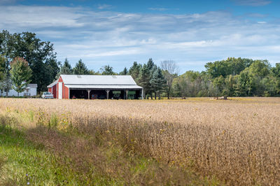 House on field against sky