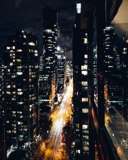 Illuminated buildings in vancouver city at night