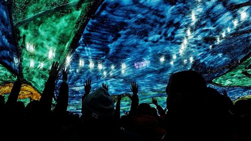 People photographing in aquarium