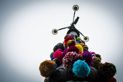 Low angle view of balloons against sky