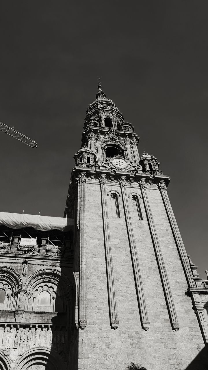 LOW ANGLE VIEW OF CLOCK TOWER AGAINST BUILDING