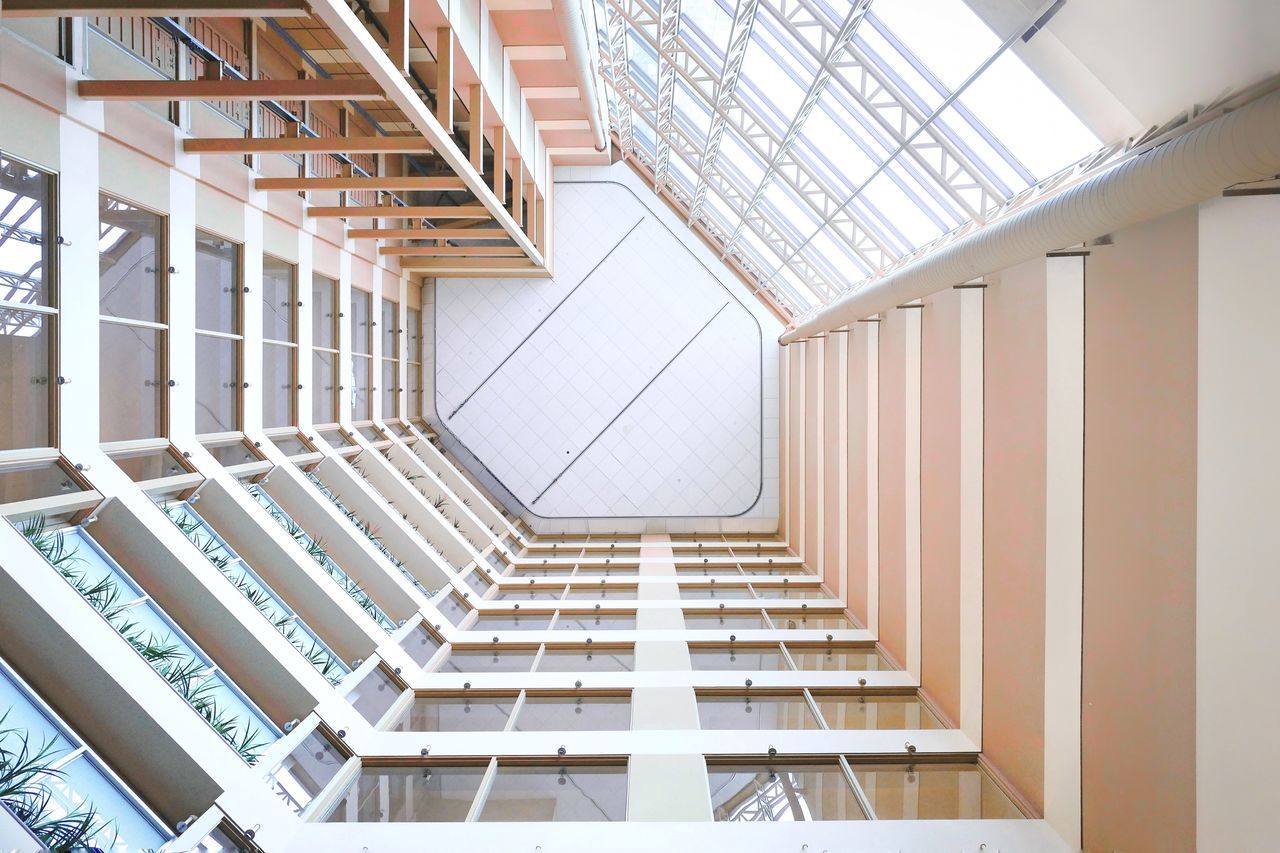 architecture, built structure, building, steps and staircases, indoors, staircase, ceiling, low angle view, no people, railing, white color, pattern, day, modern, architectural feature, skylight, metal, empty, directly below, roof beam