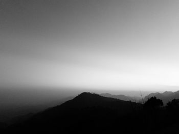 Scenic view of silhouette mountain against clear sky