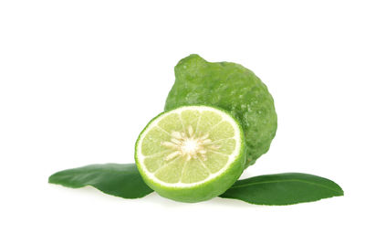 Close-up of lemon slice against white background