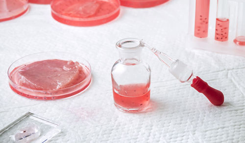 High angle view of red wine bottles on table