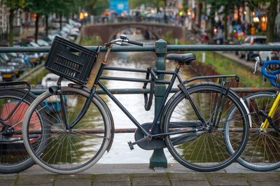 Bicycle parked by railing in city