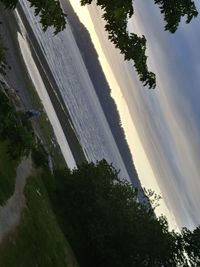 Scenic view of river against blue sky