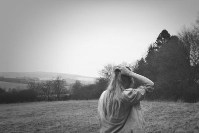 Woman standing on field