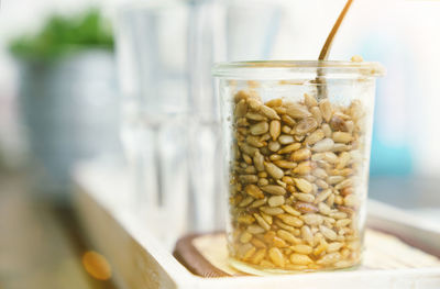 Close-up of glass of jar on table