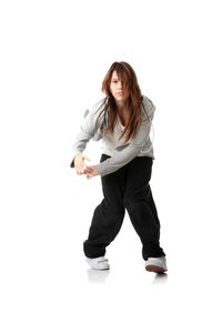 Portrait of young woman standing against white background
