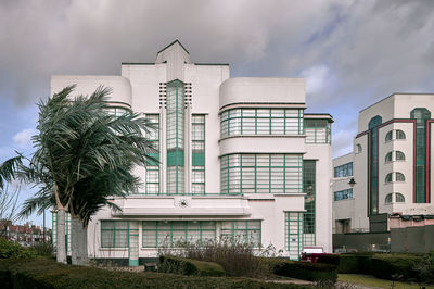 View of apartment building against cloudy sky