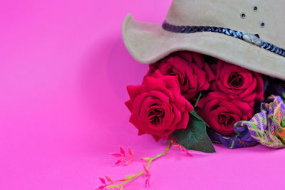 Close-up of rose bouquet against pink background