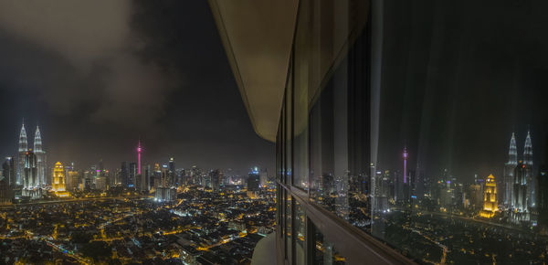 Panoramic view of illuminated city at night