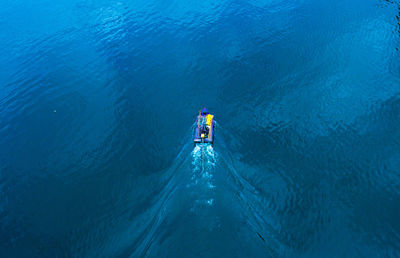 High angle view of people on sea