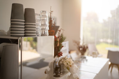 Coffeehouse interior in loft style with stools near bar counter desk, coffee machine, glass showcase