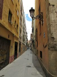 Alley amidst buildings in city