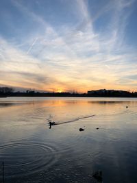 Scenic view of lake against sky during sunset
