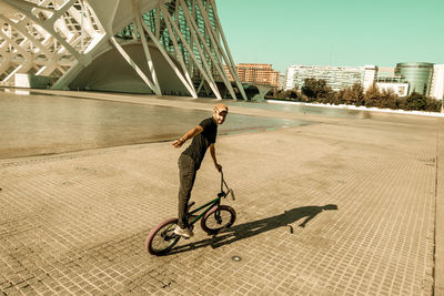 Man riding bicycle on street