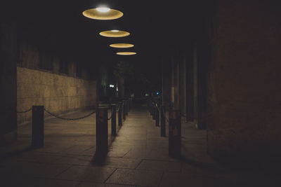 Empty illuminated street at night
