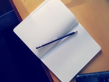 Close-up of pen on table