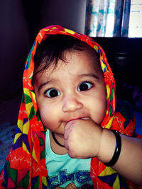 Close-up portrait of cute baby at home