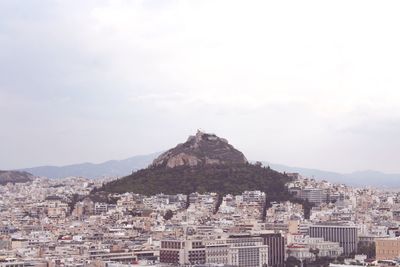 Buildings in city against sky