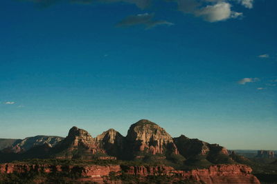 Scenic view of rocky mountains against clear sky