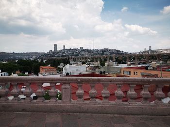 High angle view of buildings in city against sky