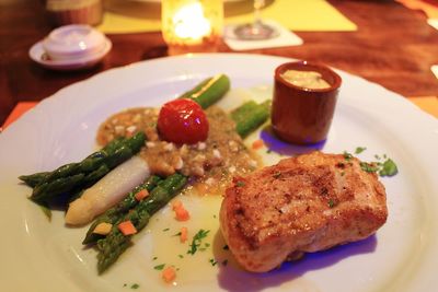 High angle view of fish steak served in plate on table