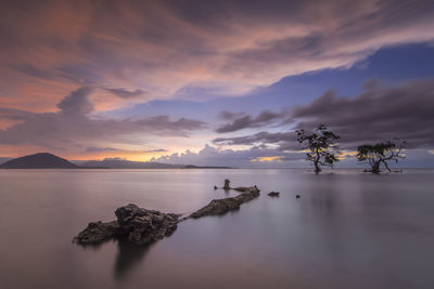 Scenic view of lake against sky during sunset