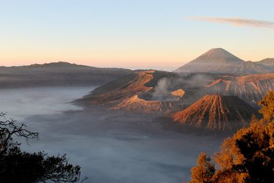 Scenic view of mountains against sky during sunset