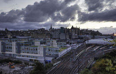 High angle view of railroad tracks amidst buildings in city