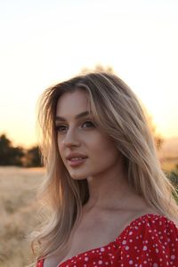 Beautiful sexy attractive girl enlightened by sunset
