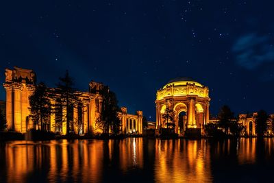 Illuminated buildings in city at night