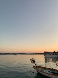 Scenic view of sea against clear sky during sunset