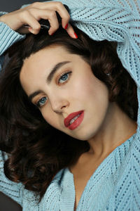 Portrait of beautiful woman blue eyes blue clothes