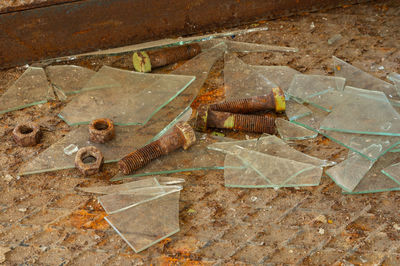 High angle view of rusty metal on floor