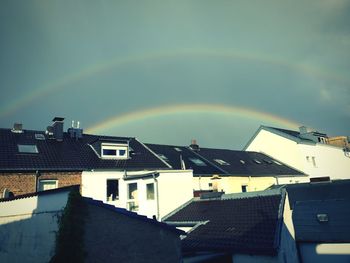 Rainbow over houses in town