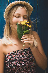 Young woman holding flower bouquet