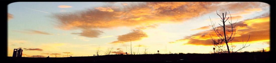 Low angle view of cloudy sky at sunset