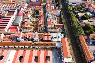 Aerial view of a small residential district in lisbon outskirt along a railway, lisbon, portugal.