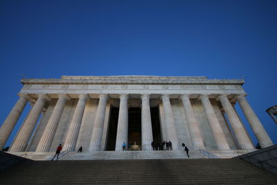 Low angle view of building against blue sky