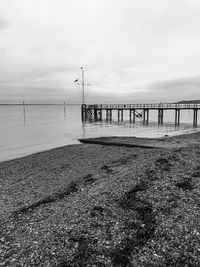 Pier over sea against sky