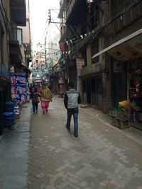 People walking on street in city