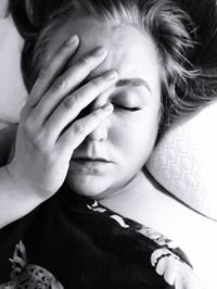 Close-up portrait of woman with hands