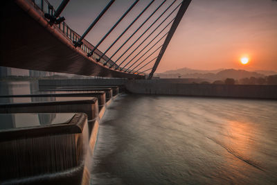 Bridge over river against sky