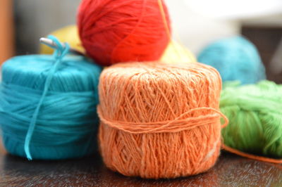 Close-up of colorful wool balls on table