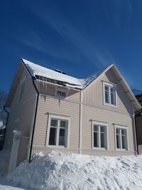 Low angle view of building against sky during winter