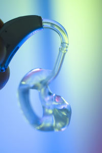 Close-up of water drop against blue background