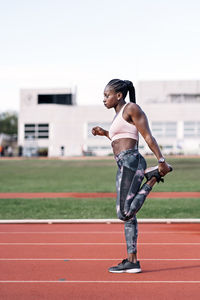 Full length of woman standing on field